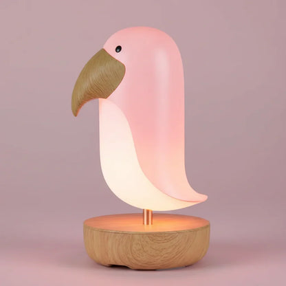 macro-veilleuse-oiseau-rose-fond-d-grad-pastel