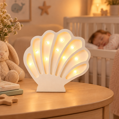 Veilleuse bébé Coquillage lumineuse près d’un bébé endormi